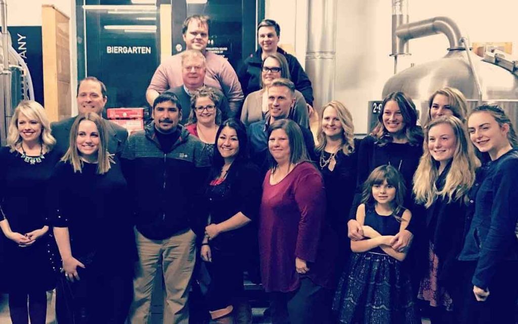 Last year’s recipients of the Christmas wish with their nominators and event organizers at Lock Street Brewery. 