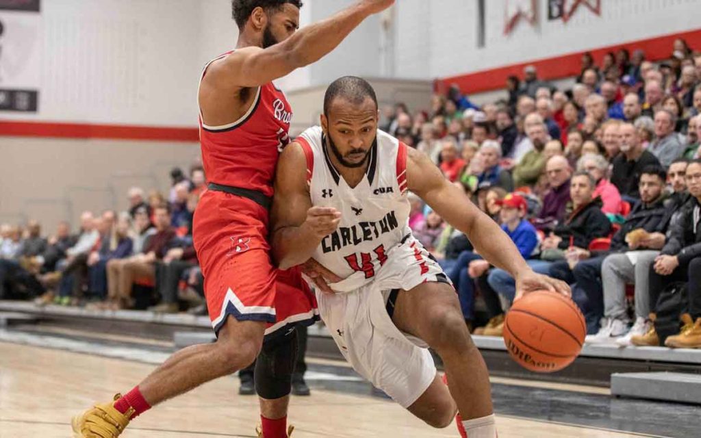 Brock's Tyler Brown (left) defends Troy Reid-Knight of the Carleton Ravens during the OUA semifinals in Ottawa on Wednesday.