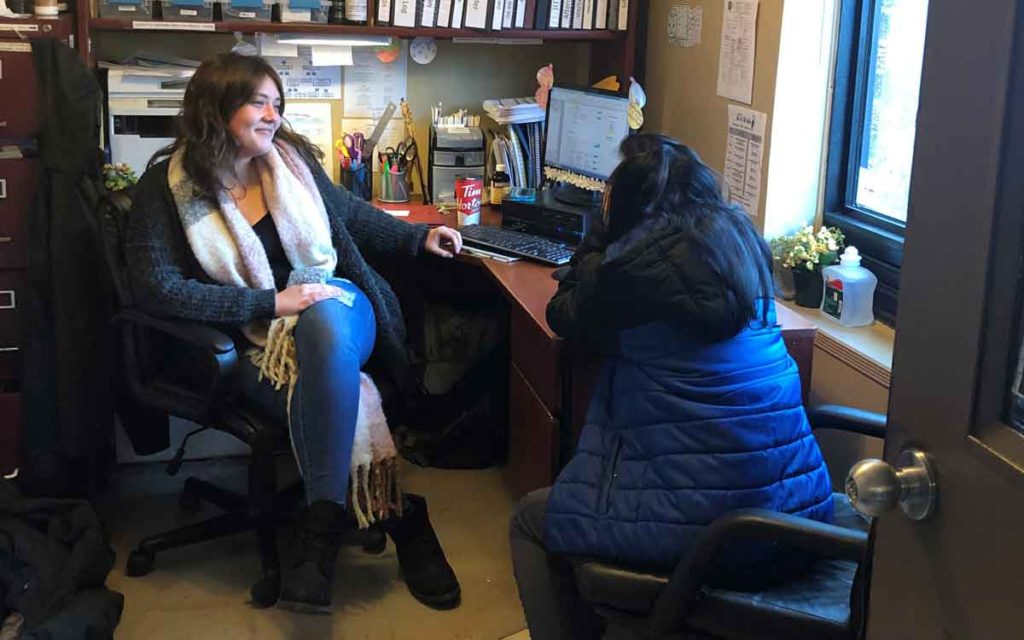 A Niagara youth speaks with a RAFT employee at the St. Catharines facility. 