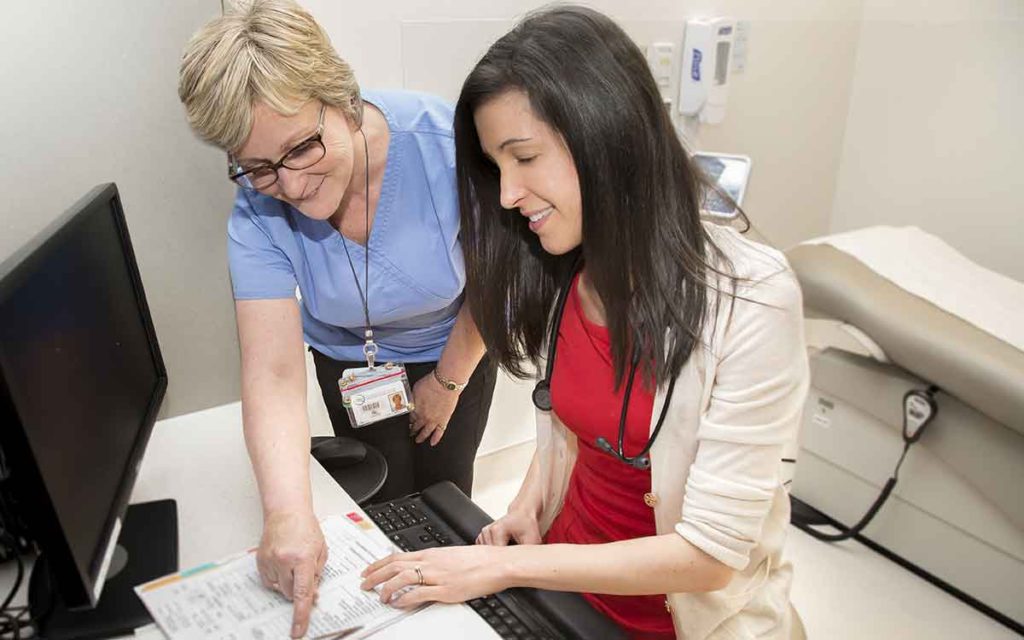 Nephrologist Dr. Kathleen Quinn with dialysis Charge Nurse Arden Gibson