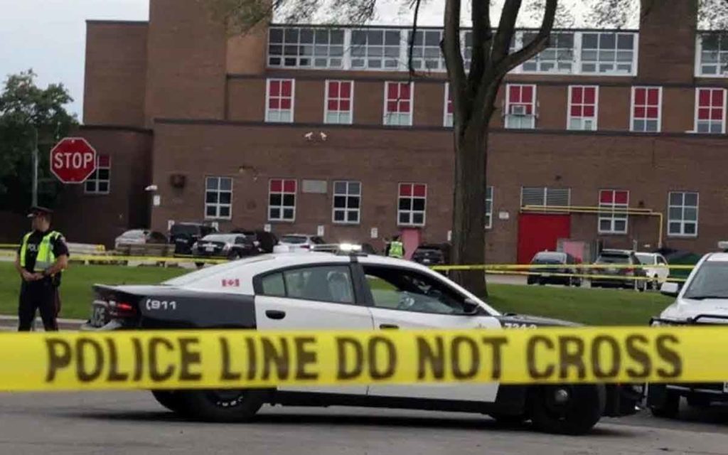 : Police seal off a crime scene at Sir Winston Churchill Secondary School 