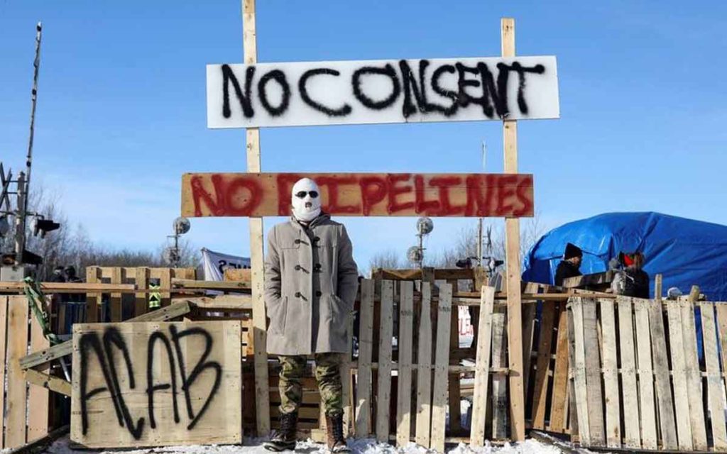 person at pipeline blockade