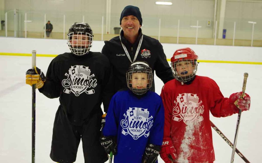 todd simon with participants of his hockey camp
