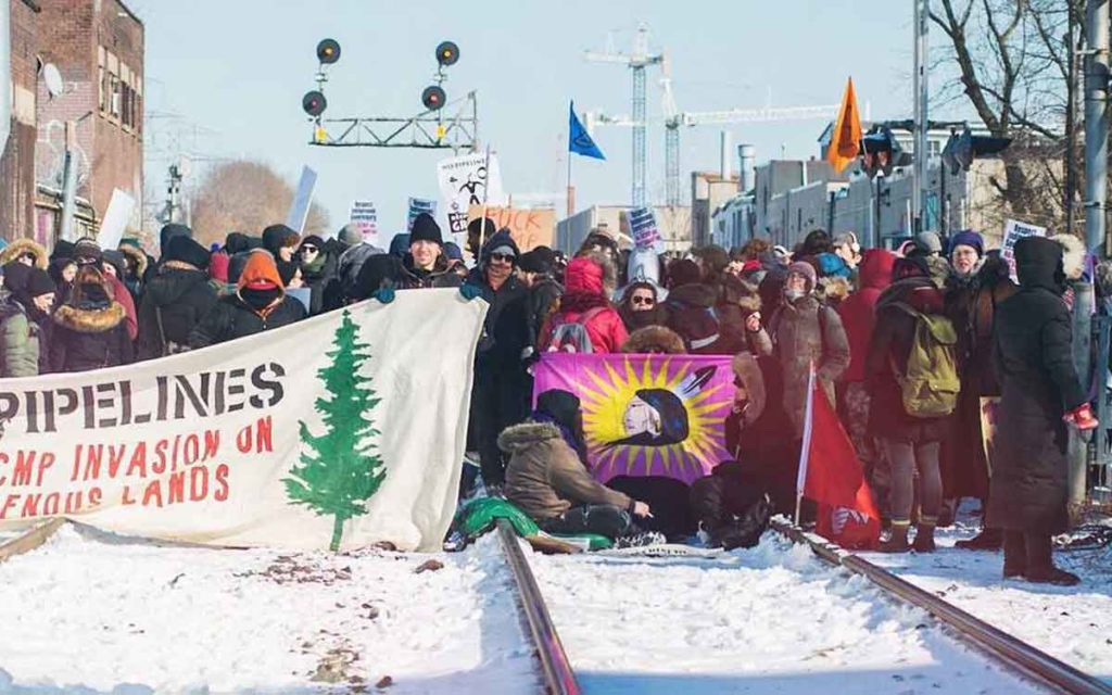 protestors blocking a rail line