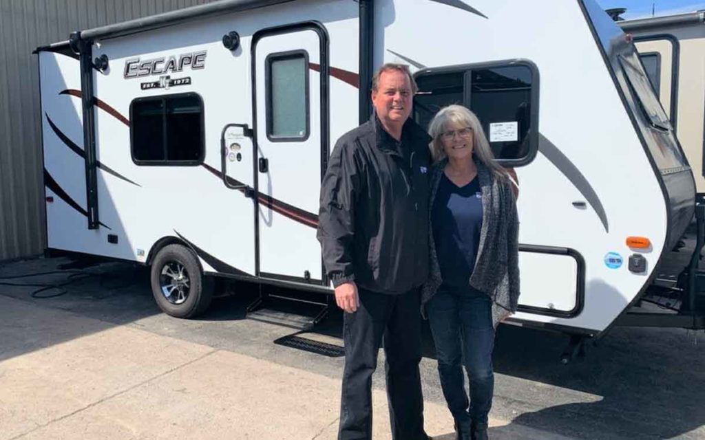 Niagara RV owner John Petrie and his wife Anna beside one of the trailers 