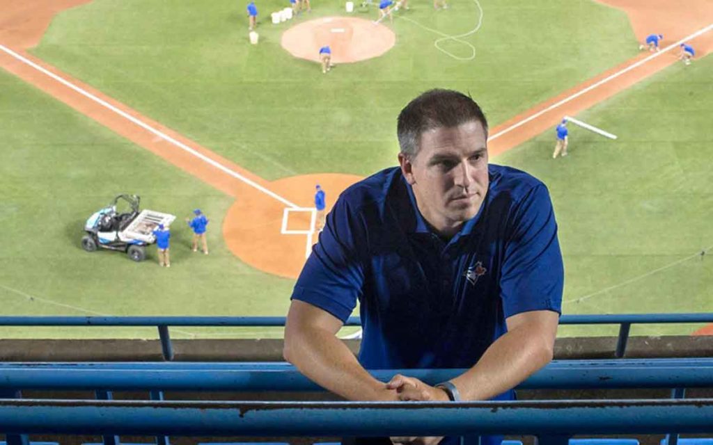 Andrew Tinnish standing  in the ballpark