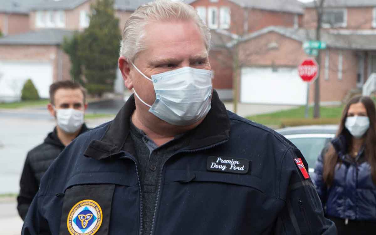 Premier Ford wearing a face mask