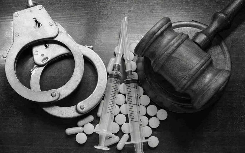 handcuffs, drugs and a gavel