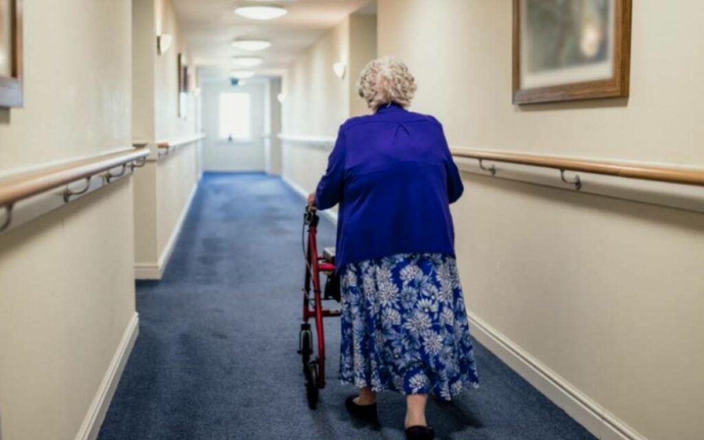 a senior walking down the hall