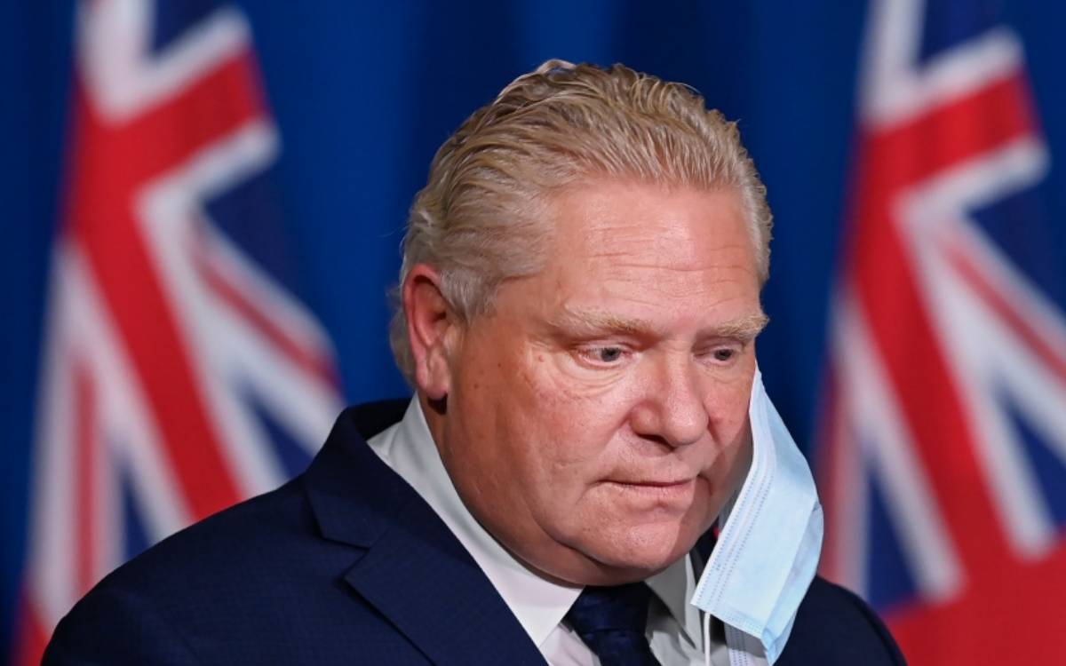 premier ford removing his mask