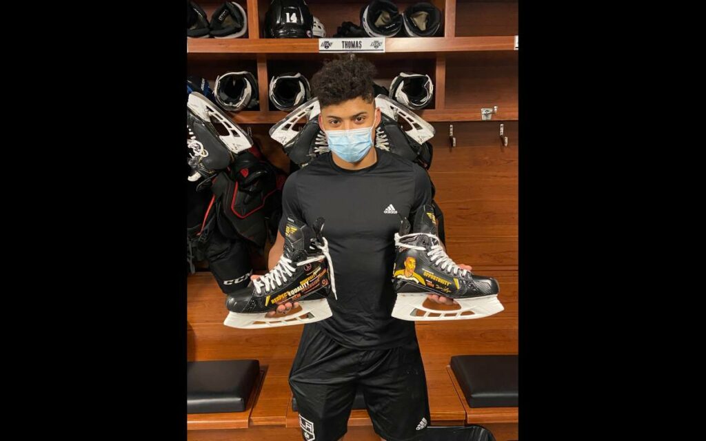 Akil Thomas with his Willie O'Ree skates.