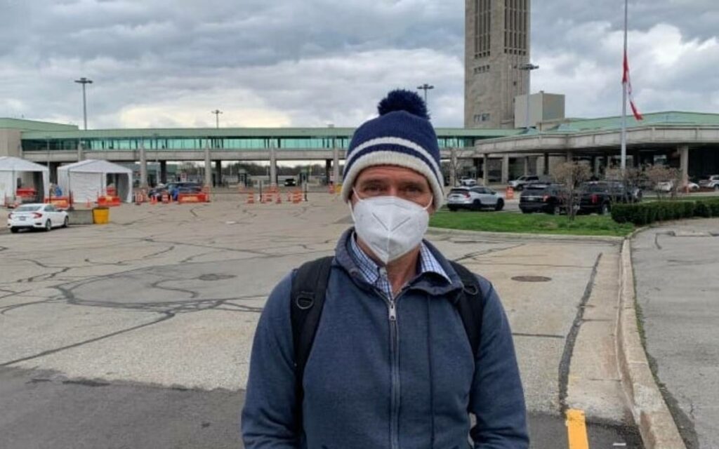 man in mask at the bridge