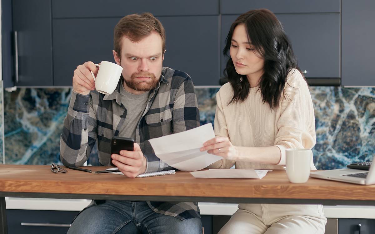two people looking over a document