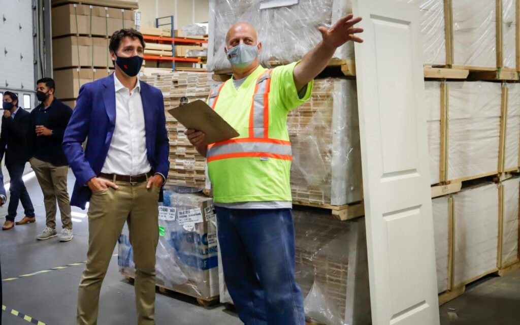 PM trudeau in. a warehouse