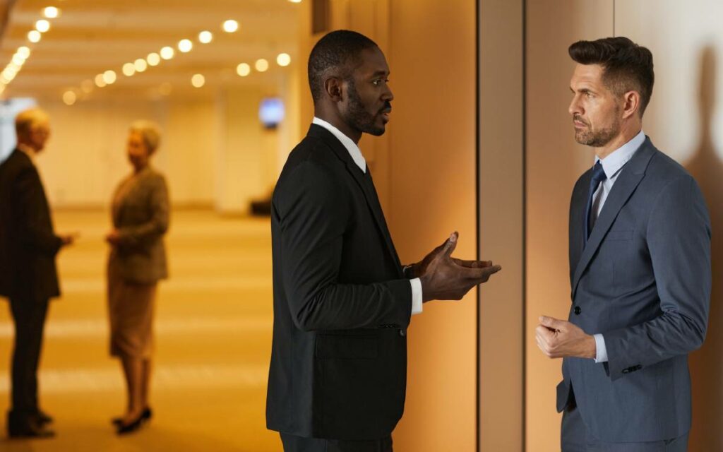 two men talking in a convention centre