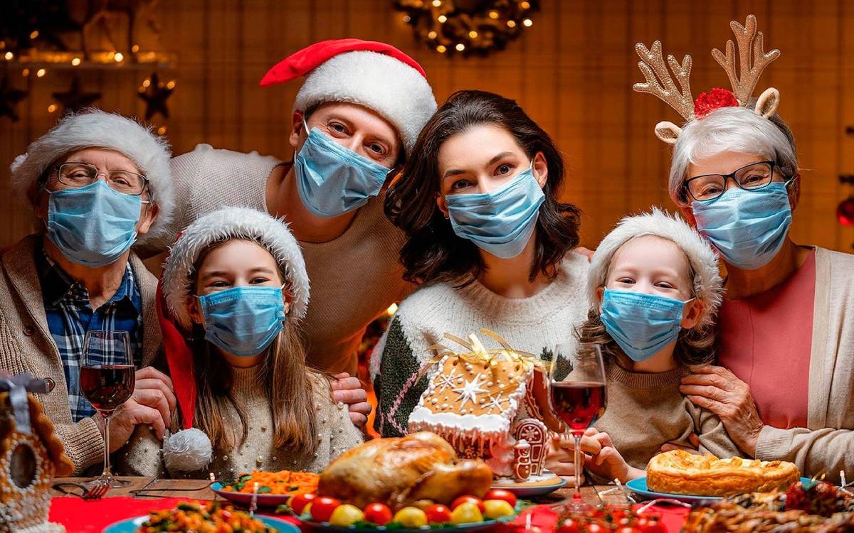 family wearing masks at Christmas time