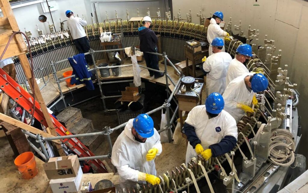  Technicians installing one of two new generating units